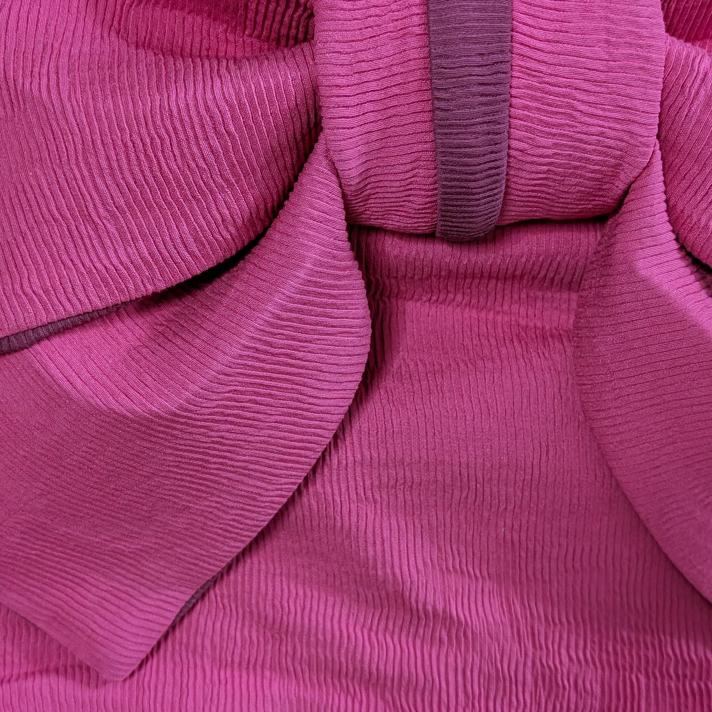 Close-up of pink ribbed fabric texture