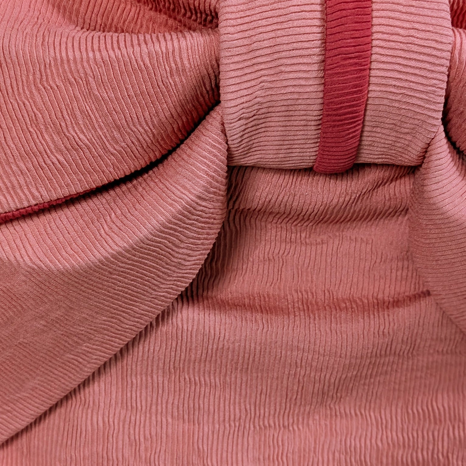 Close-up of pink ribbed fabric from a Japanese waist belt