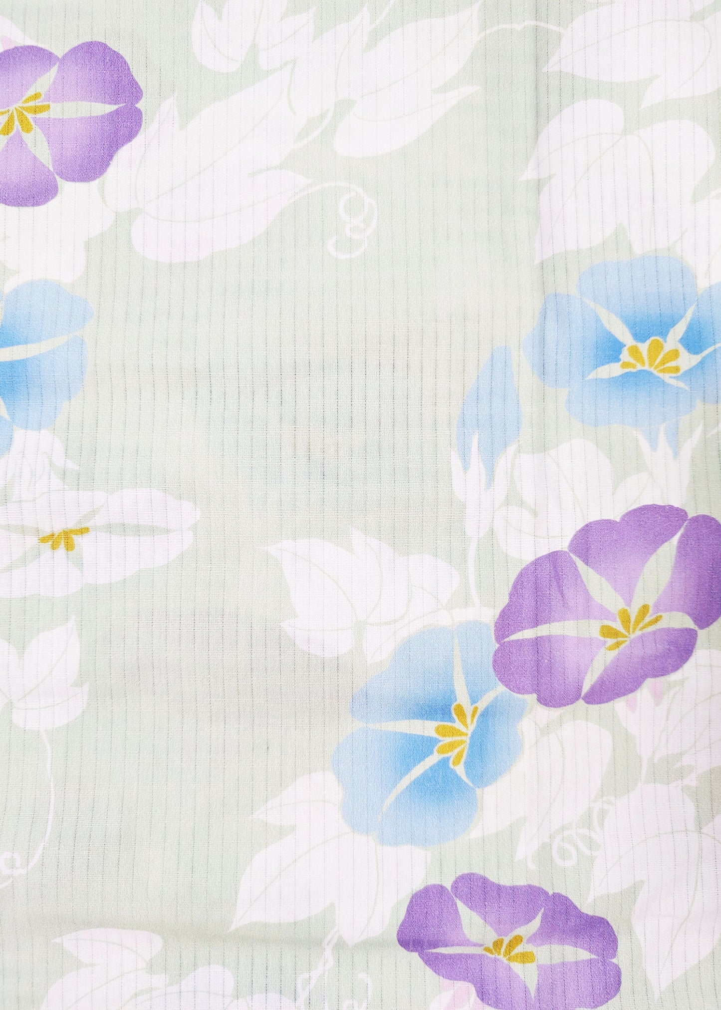 Floral pattern with purple and blue flowers on a textured white background
