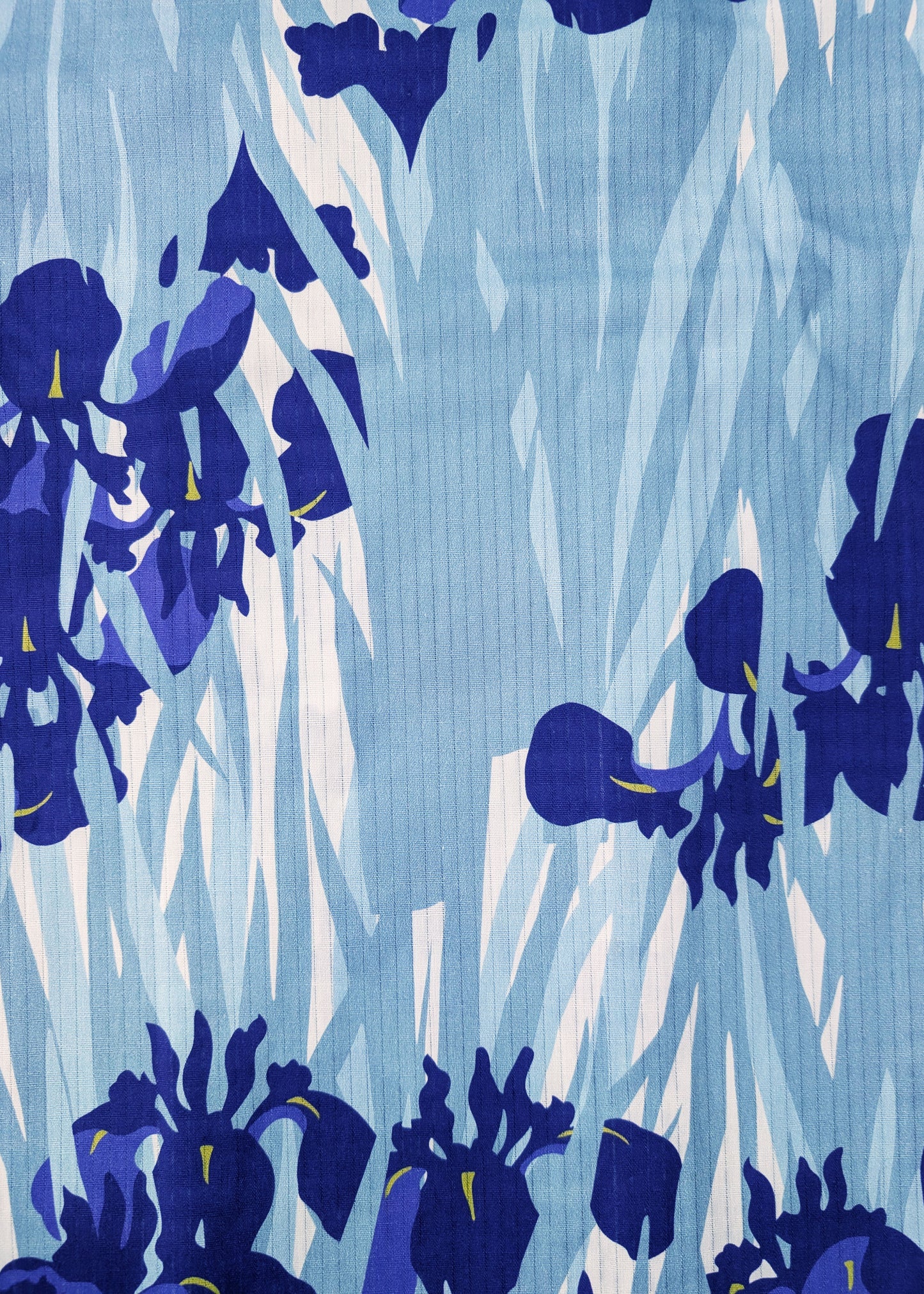 Pattern of blue flowers on a light blue background