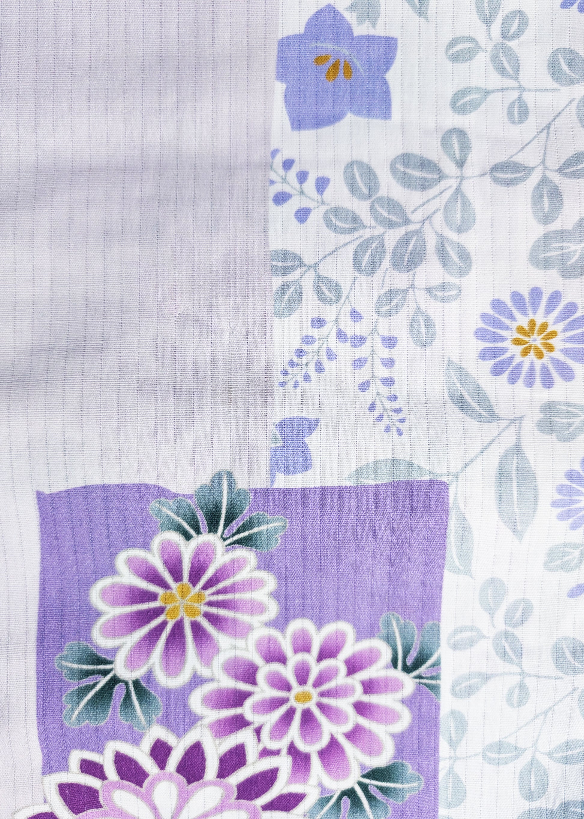 Floral pattern with purple and green flowers on a textured white background