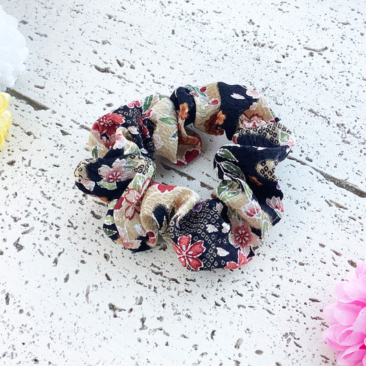 Japanese fabric scrunchie in black and beige with cherry blossoms