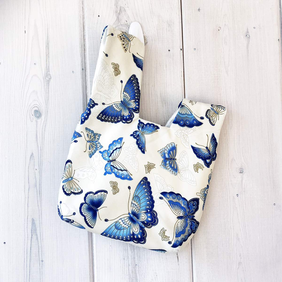 Kimono Knot Bag Wristlet Butterfly Beige - Front