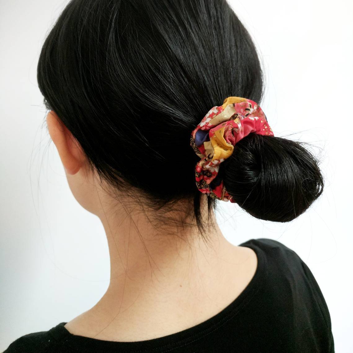 woman wearing a cherry blossom scrunchie